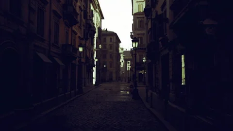Narrow dark corridor with contrasting silhouettes and cobbled path Stock Footage 333991679