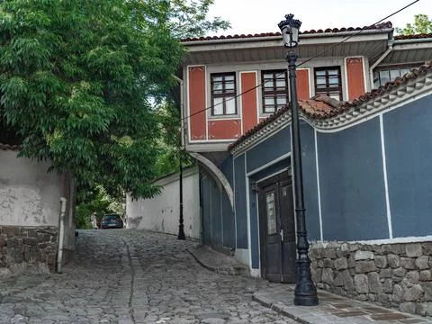 Narrow empty paved streets of old town of Plovdiv Stock Photos