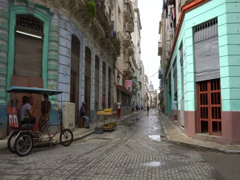 Narrow empty street view on pavement leading to central square with Capitol in Stock Footage 70857499