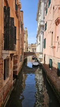 Narrow Empty Venice Canal Between Brick Buildings Stock Photos