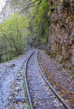 A narrow gauge railway with a solid foundation in a mountainous area in early 库存照片