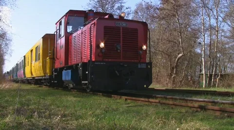 Narrow gauge train passing by Stock Footage 708090
