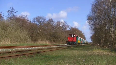 Narrow gauge train passing by Stock Footage 708125