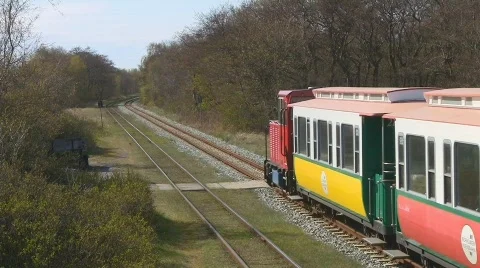 Narrow gauge train passing by Stock Footage 708128