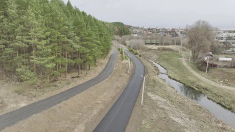 Narrow intercity highways pass through forest landscape Видео 326467484