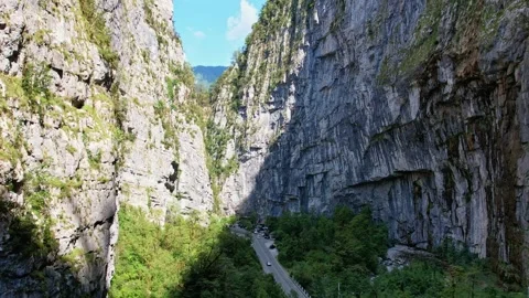 A narrow mountain gorge in summer, a drone flies through the gorge, the walls Video stock 256331953