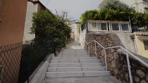 Narrow old steps on the streets in Monaco and roads with cars in Monte Carlo Stock Footage 95539508