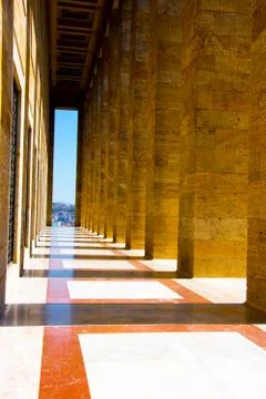 The narrow passage with the pattern columns making shadows aroun Stock Photos