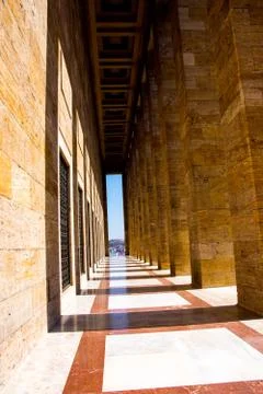 The narrow passage with the pattern columns making shadows aroun Stock Photos