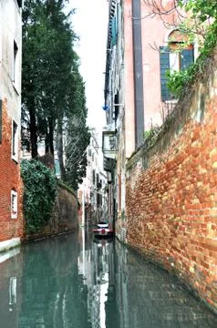 A narrow passageway within The Grand Canal, Venice, Italy. Stock Photos