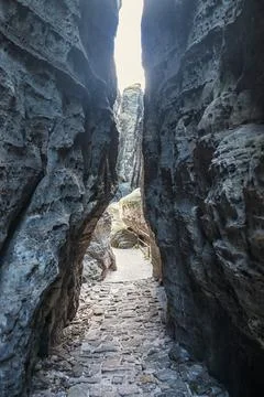 Narrow path between rocks in sandstone mountains Stock Photos