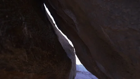 Narrow path between two huge rocks Stock Footage 99743414