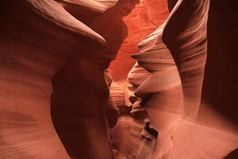 The narrow path surrounded by red walls in the Antelope Canyon Stock Photos