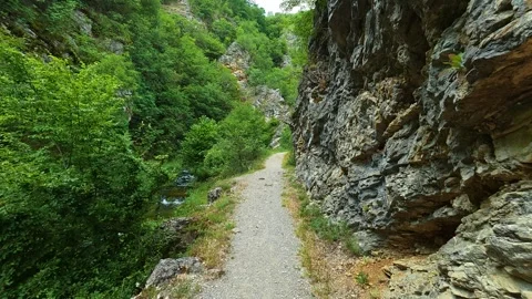 Narrow path winds through rocky canyon. Gradasnica River Canyon, Serbia Vídeo Stock 341962025