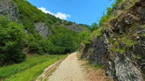 Narrow path winds through rugged. Gradasnica River Canyon, Serbia Stockbeeldmateriaal 342320034