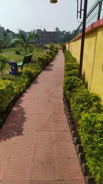 Narrow pathway to walk inside the park Stock Photos