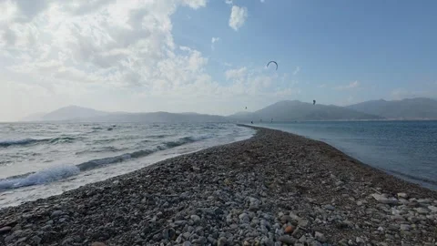 Narrow Pebble Beach Surrounded by Waves on a Windy Island Coast Video stock 337046601