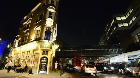 Narrow Pub on corner with passing traffic in London Stock Footage 12564513