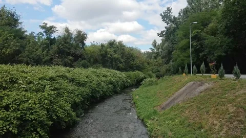 Narrow river flowing through beautiful park Topcider in Belgrade, Serbia Stock Footage 270156130