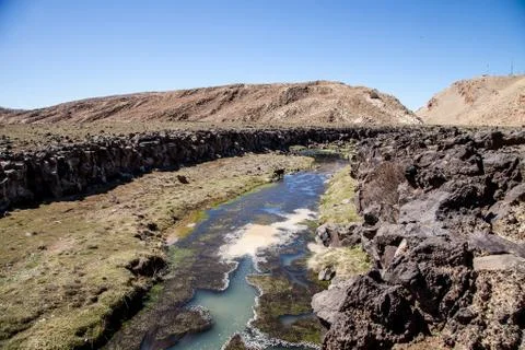 A narrow river in the steppe Stock Photos