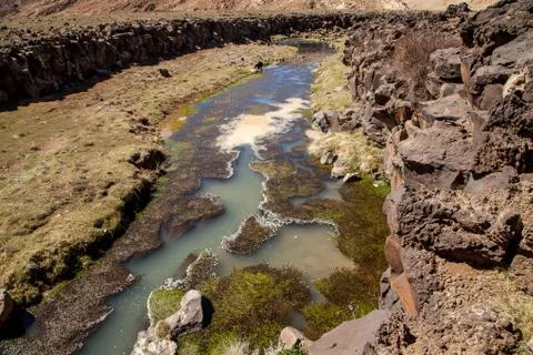 A narrow river in the steppe Stock Photos
