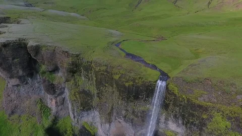 A narrow river wanders through the valley in Iceland. Andreev. Stock Footage 78550018