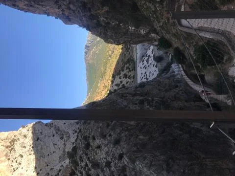 Narrow road and a view between two mountains Stock Photos