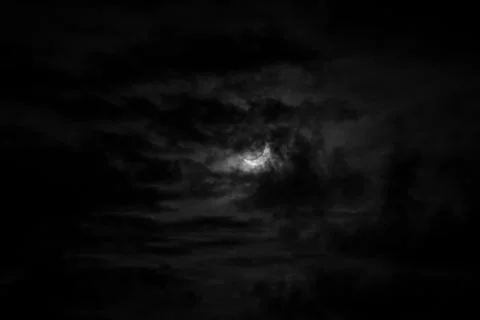 A narrow semicircle of the moon in cloudy cloudy weather. Sickle, crescent .. Stock Photos