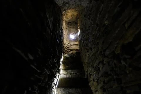 Narrow stone steps inside a medieval tower in a fortified church in the Trans Stock Photos