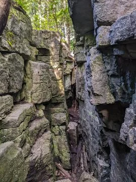 Narrow Stone Wall Path Between Ancient Rock Formations in Canyon Forest Stock Photos