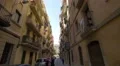 Narrow street between yellow buildings in Barcelona 4k or 4k+ Resolution