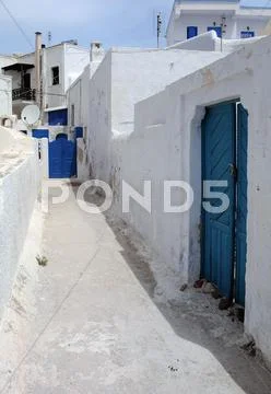 Narrow street in pyrgos village Stock Photos