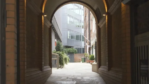 A narrow street view through an arch. Stock Footage 152423978