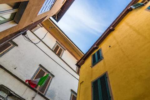 Narrow streets of Lucca ancient town with traditional architecture, Italy. Stock Photos