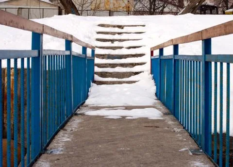 Narrow technological bridge to the stairs Stock Photos