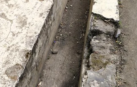 Narrow Trench Between Concrete Structures Stock Photos