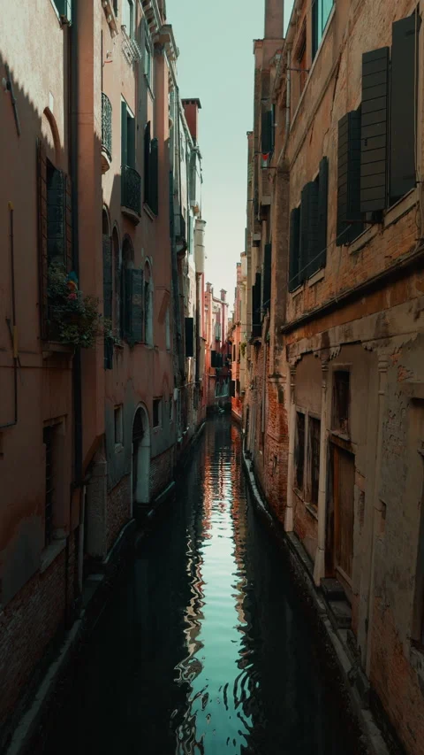 Narrow Venice waterway between closely packed buildings Stock Footage 336712132