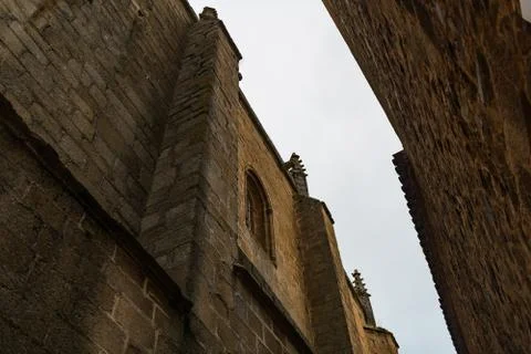 Narrow view of the sky between the high walls of the buildings of the old town Stock Photos