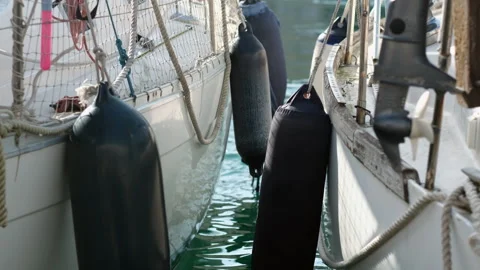 Narrow Water Gap Between Moored Yacht Hulls in Motion Stock Footage 330863602