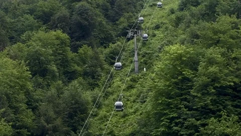 Narrow Waterfall Streams Through Dense Green Mountain Vegetation Stockbeeldmateriaal 300199917