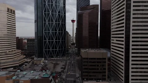 Narrow to wide, reverse shot of the Calgary Tower at Downtown Calgary, Canada Видео 336354836