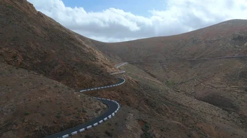 The narrow, winding and steep road of Fuerteventura in The Canary Islands Spain Stock Footage 277117448