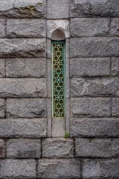 Narrow window with bars. Stock Photos