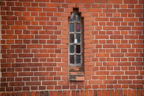 A narrow window in the wall Stock Photos