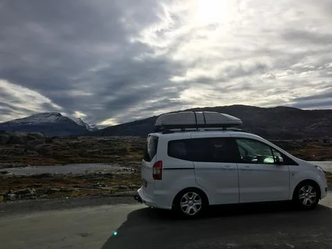 Narvik, Norway; September 6 2016: White van traveling through Norwegian mou.. Stock Photos