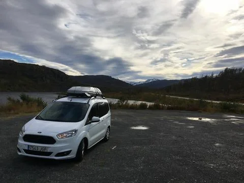 Narvik, Norway; September 6 2016: White car traveling through Geitvassdrage.. Stock Photos