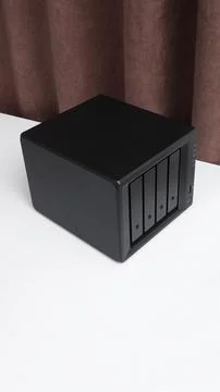 NAS server. Network storage. Device for backing up data on a white table Stock Photos