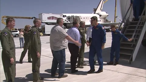 NASA astronauts disembarking from Space Shuttle Atlantis following STS-125 Stock Footage 283627429