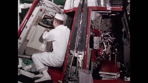 NASA Engineer working on hatch of Gemini Space Program capsule Stock Footage 263418807