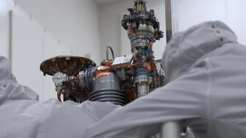 NASA engineers assembling Europa Clipper's MASPEX instrument onto spacecraft Video stock 289534425